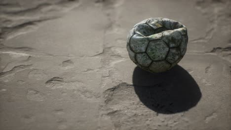Old-soccer-ball-the-cement-floor